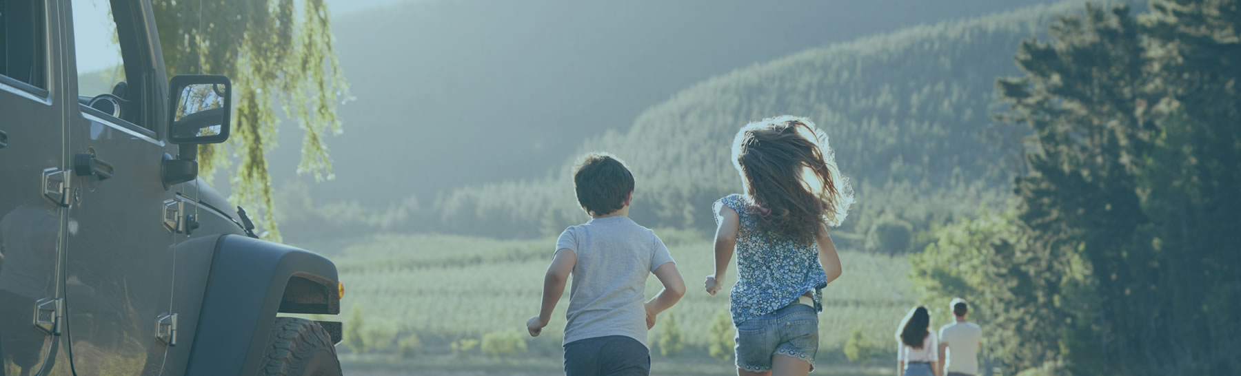 Children Running Toward Lake After Getting Out Of Car